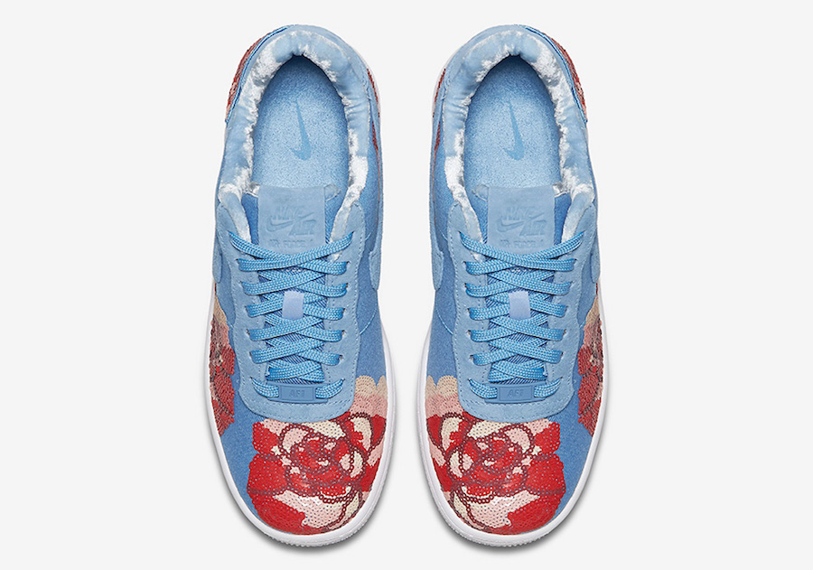 blue nikes with flowers