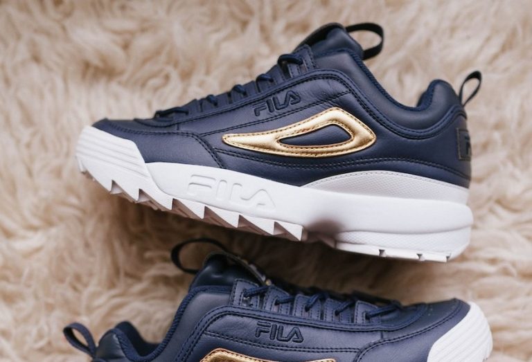 black and gold fila trainers