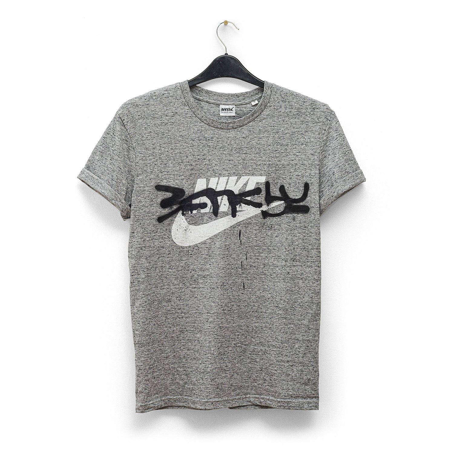 banksy-tagged-nike-t-shirt