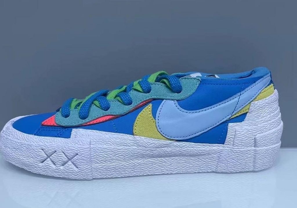 First Look At Nike, Sacai And KAWS Blazer Low Sneaker In Burgundy And Blue